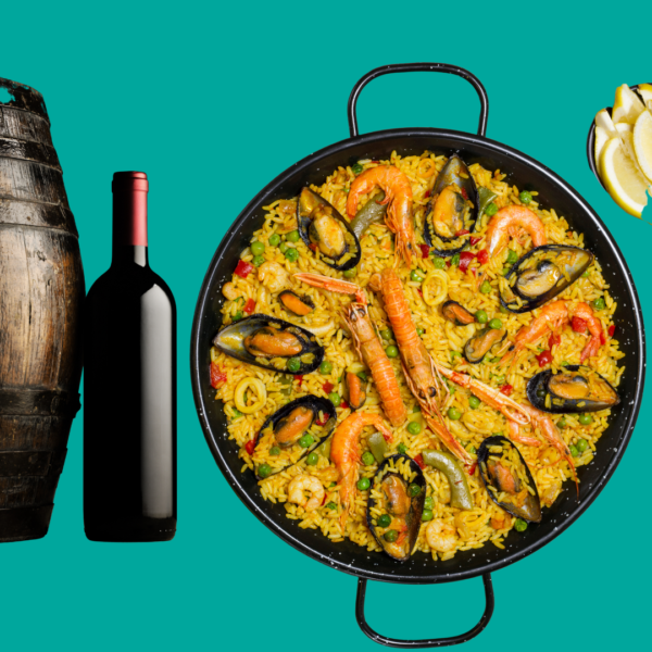 a bottle of wine near barrel with spanish seafood paella