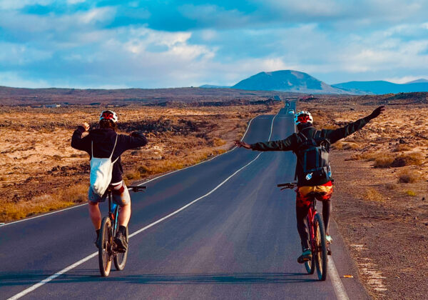 two friends on a bike in fuerteventura